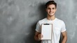 © Steve - Confident man with blank clipboard outdoors