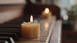 © CYBERPINK - Single candle burning on a piano keyboard. the candle is in the center of the image, with its flame burning brightly.