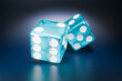 © Midea  - Two translucent blue dice are resting on a dark, reflective surface