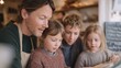 © CYBERPINK - Father and his two young children in a cafe. the father is wearing a green sweater and a beige apron, and he is looking down at a menu in front of him.