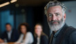 © sornram - Confident business leader in modern office, showcasing leadership and teamwork in a collaborative environment.