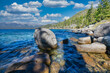 © Volodymyr - Lake Tahoe California USA view of clear turquoise water with granite rocks and pine forest along mountain shore under blue sky with clouds scenic summer landscape of Sierra Nevada nature