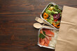 © Alina Zavhorodnii - Healthy meal slimming diet plan daily ready menu background, organic fresh dishes and smoothie, fork knife on paper eco bag as food delivery courier service at home in office concept, close up view.