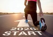 © keks20034 - Determined runner at the start line marked START and 2026, symbolizing new goals, ambitions, and success in the new year