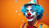Colorful portrait of a cheerful clown with blue curly hair, red nose, and bright face paint smiling against an orange background with confetti. Fun and vibrant carnival or party concept, photo, macro