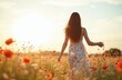 © Maryna - Young woman in white dress walks in meadow with red poppy flowers at sunset. Female person enjoys nature, freedom. Girl spreads arms, relaxes in blooming field. Female long hair. People in floral