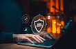 © Supatman - Work safety and occupational health concept. Person using laptop with icons for protection, risk management, assessment and safety protocols compliance in modern workplace and industrial environments.