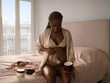 © Milles Team/Stocksy - Pregnant woman doing self care routine