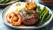 © MBRAMO - Grilled Steak with Shrimp and Asparagus