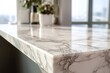 © kamims - Polished stone countertop surface exhibits natural veining near a sunlit window view