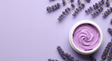A beautiful flat lay of lavender body cream surrounded by fresh lavender sprigs, a perfect monochromatic image for calming and aromatic skincare
