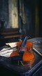 © KM - Old viola rests on vintage table surrounded by sheet music, creating dramatic and nostalgic atmosphere. soft lighting enhances instrument rich wood tones