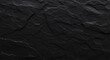 © 彭若强 - Dark textured stone surface with natural cracks and subtle veining