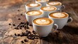 © celeng - Artistic coffee presentation with detailed latte art in white cups on a rustic wooden surface