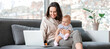 © Pixel-Shot - Working mother with her baby in office