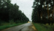 © Ivan Andrianov/Stocksy - Raindrops on a Car Window During a Cloudy Day in the Countryside