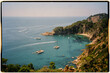 © Adrian Rodd/Stocksy - Panoramic shot of a bay on the Costa Brava, Barcelona, Spain