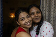 © Dream Lover/Stocksy - Two Young Indian lady looking at camera inside home, close up shot