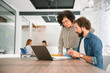 © BusinessClass by W61 - Colleagues collaborating and working together with a laptop in office