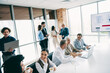 © deagreez - Professionally coordinated business gathering with diverse team members collaborating on a strategic project at a modern corporate office