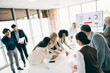 © deagreez - Diverse team of professionals collaborating actively in a modern office, sharing strategies and ideas during a strategic meeting