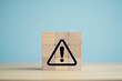 © Stock Studio - Warning sign on wooden blocks concept for risk management and safety awareness presentation slide design