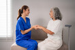 © Pichsakul - Asian nurse supports elderly woman providing compassionate nursing care promoting wellbeing home environment comfort and happy health