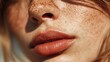 © Anastasiia - Close-up of a freckled face with pink lips, a sunlit nose, and freckles scattered across the cheeks and nose. Concept Freckled close-up portrait, Sunlit nose and cheeks, Pink lips detail