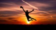 © kamral - Dramatic silhouette of goalkeeper leaping to catch ball against stunning sunset sky, symbolizing athletic prowess, fitness goals, and the thrill of victory