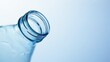 © Aliaksandr Barouski - Close-up of a clear plastic water bottle against a soft blue background