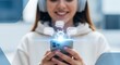 © Mostafizur - Woman wearing headphones interacting with a chatbot on her smartphone, symbolizing ai communication and digital assistance