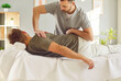 © Studio Romantic - Professional doctor, chiropractor, osteopath or physiotherapist, helping man patient with back pain and tension. Chiropractic therapy, osteopathy, treatment, rehabilitation concept