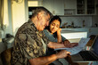 © Marko Geber - Mature father and teen daughter worried over bills at home