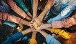 © Rifqi - Diverse group hands stacked together symbolizing collaboration and unity from above eye level shot, concept for teamwork, partnership and corporate success