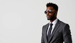 © bell - A stylish photo of a young African American man exuding confidence in a suit and sunglasses