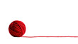 © Hasan - Bright red yarn ball with string trailing on a black background, textured, soft, and inviting, minimalist