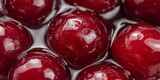 Glossy Red Cherries in Liquid