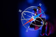 © vegefox.com - An illustrated compass with a hand in the background. The compass glows against a dark blue background representing travel and direct