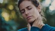 © Di - Person holding neck in discomfort,, concept of winter health issues, seasonal pain and self care for sore muscles