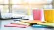 © AI Background  - Colorful Stationery and Coffee Cups on Desk with Laptop in Bright Workspace for Creative Inspiration