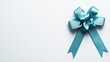 © pvl0707 - Elegant blue ribbon with a stylish bow on a pristine white surface, perfect for creative presentations and product displays