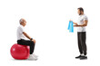 © Ljupco Smokovski - Mature man sitting on a fitness ball and talking to a sports coach