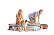 © Ljupco Smokovski - Stressed couple trying to close overpacked suitcase