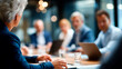© Kateryna - Faceless international executive team having board meeting defocused office meeting room background diverse employees group working with senior leader brainstorming session