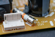 © andov - Fuse and connector on circuit board showing markings of voltage and amperage for electronic repair