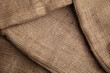© solidmaks - Wrinkled sackcloth rustic textile surface close-up
