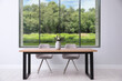 © New Africa - Table and chairs near big window in room. Interior design
