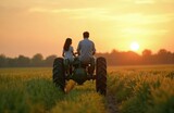 Father and daughter ride tractor in golden sunset field. Rural farming family bonding across generations, working together on agricultural land. Heritage of cultivation and country life.