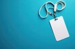 © Pete - Blank white ID card with white lanyard lies on bright blue background. This empty badge is ready for custom name, info, photo printing. It represents access, security, pro use for any business event.