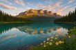 © Bijac - Vibrant summer morning at alpine lake with turquoise water mirrored pines and jagged peaks